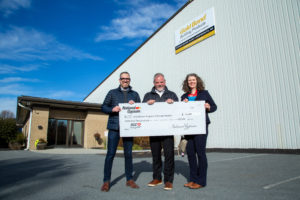 Board President Tom Aldrich of DPR Construction and Board Member Ray Houle of New England Finish join our ED Jen Fries to accept the generous National Gypsum donation.